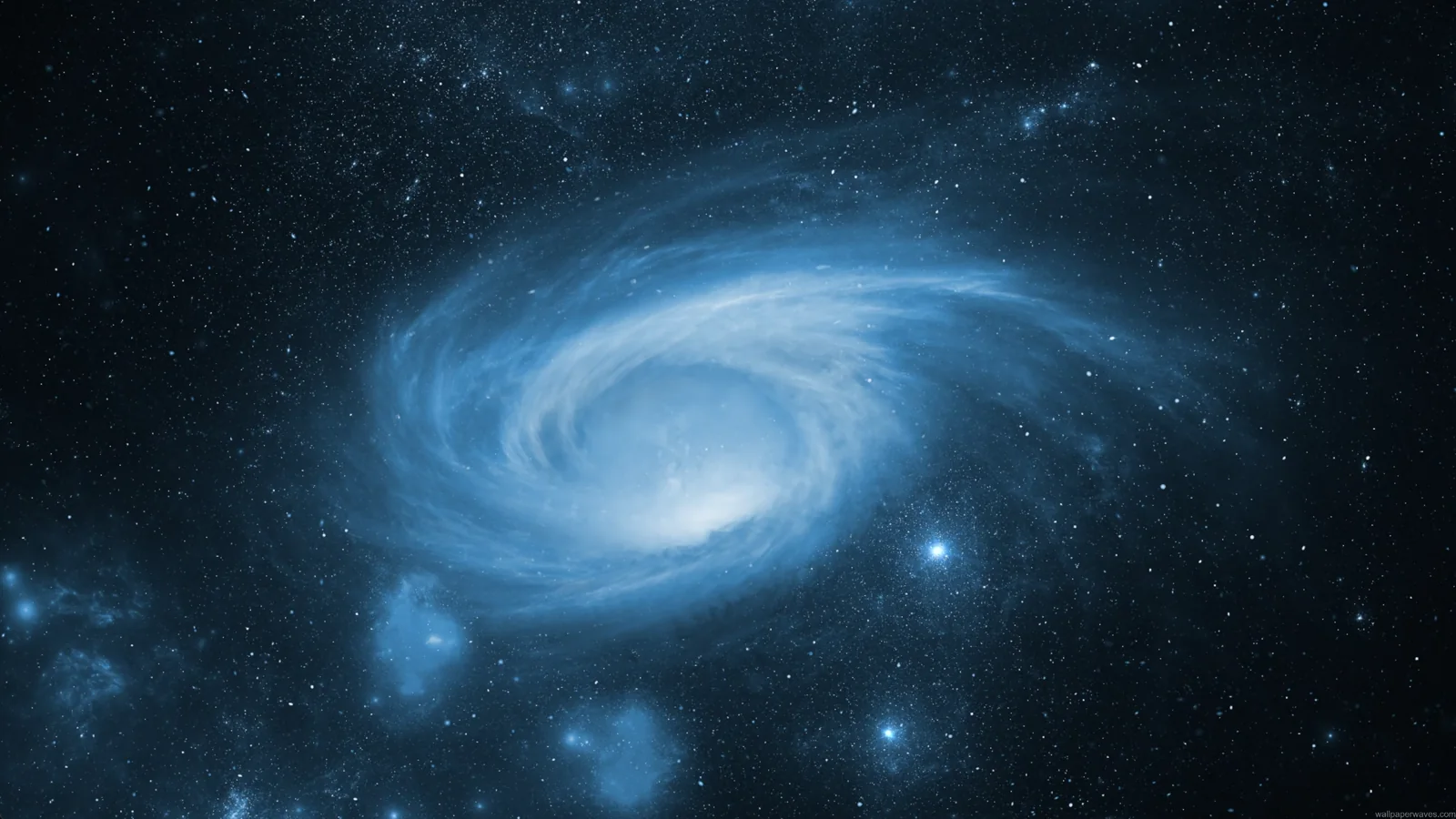 Luminous blue spiral galaxy with a white core in deep navy space