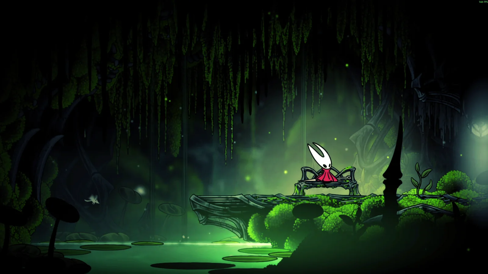 Hornet in a dark green cavern with falling luminous streaks