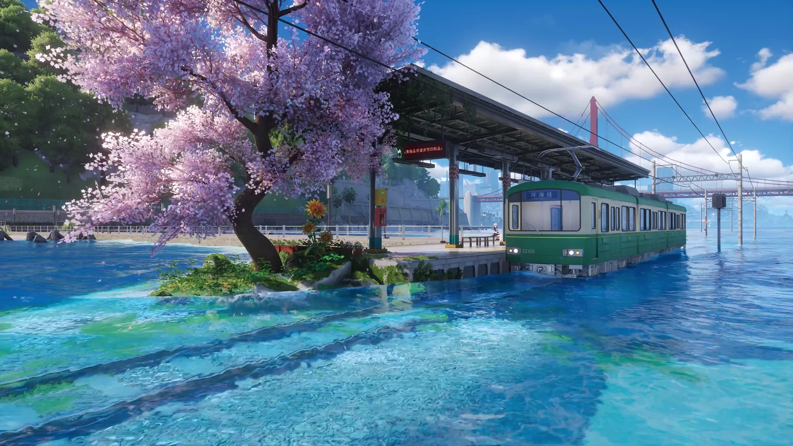 Seaside train station beneath pink blossoms and a blue sky